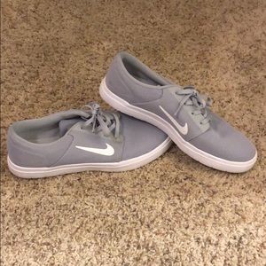 Grey and white Nike skate shoes